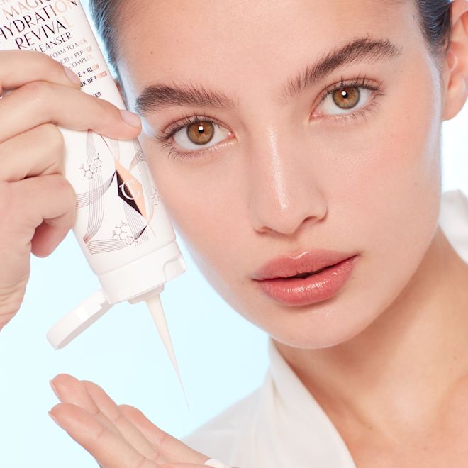 Model applying Charlotte's Magic Hydration Revival Cleanser Model applying Charlotte's Magic Hydration Revival Cleanser