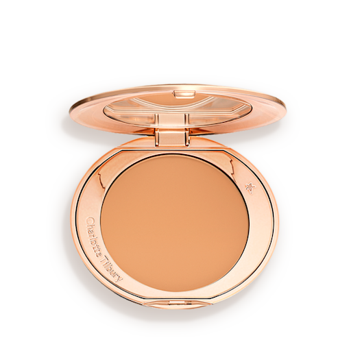 Airbrush Flawless Finish in tan open An open, pressed powder compact in a sandy-brown shade.