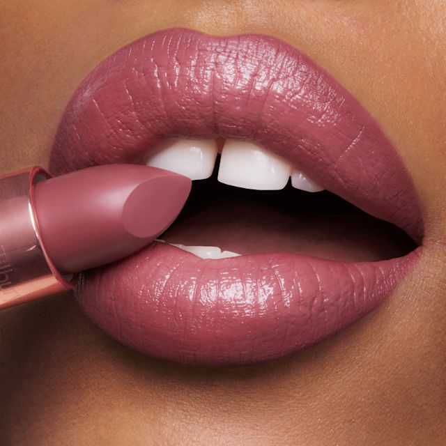 90s Pink Lipstick close up Model applying Hollywood Beauty Icon lipstick in 90s Pink