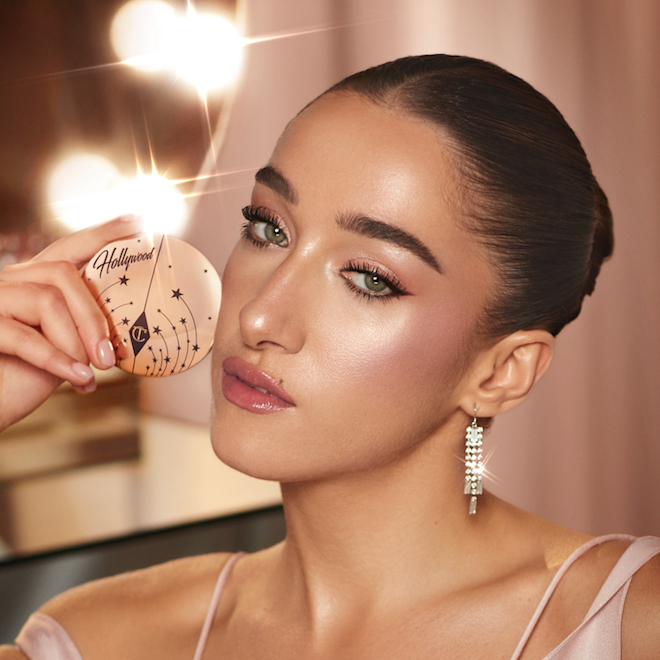 Bella Tilbury Pillow Talk model shot Bella Tilbury wearing Hollywood Glow Glide Face Architect Highlighter as a powder blush topper