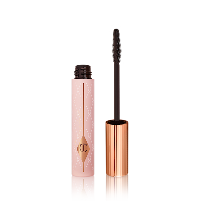 Pillow Talk Push Up Lashes! Mascara packshot for blog Mascara in a pink-coloured tube with its gold-coloured lid with a black applicator next to it.