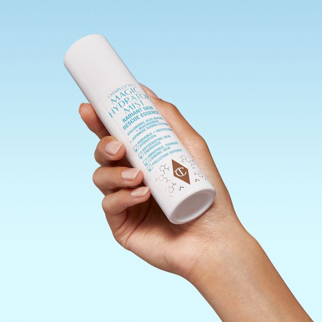 Magic Hydrator Mist still life Hand model holding Charlotte's Magic Hydrator Mist