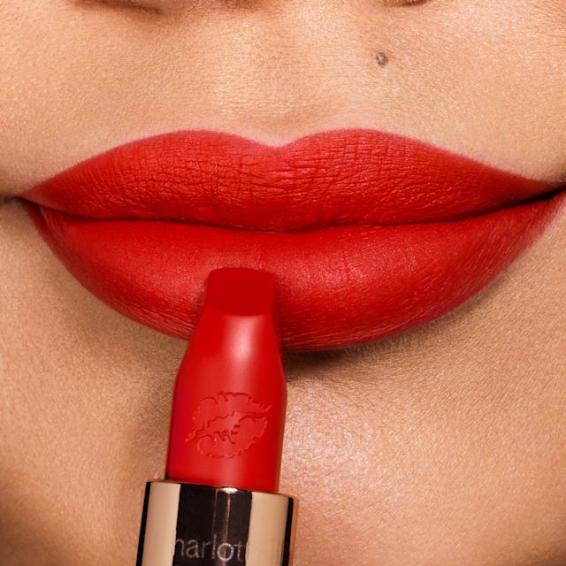 Orange Red Lipstick close up Model wearing Tell Laura orange red lipstick