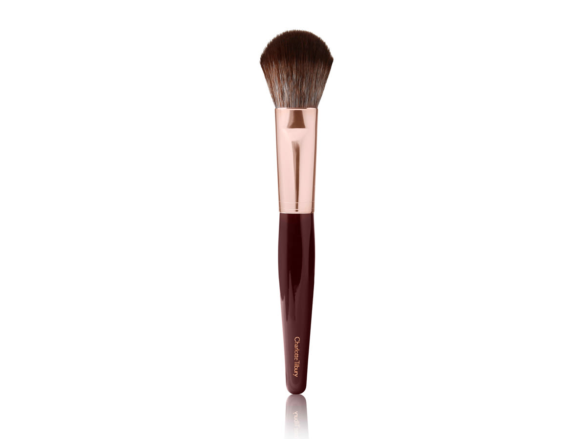 Bronzer Brush A bronzer brush in a rose gold and dark crimson colour scheme.