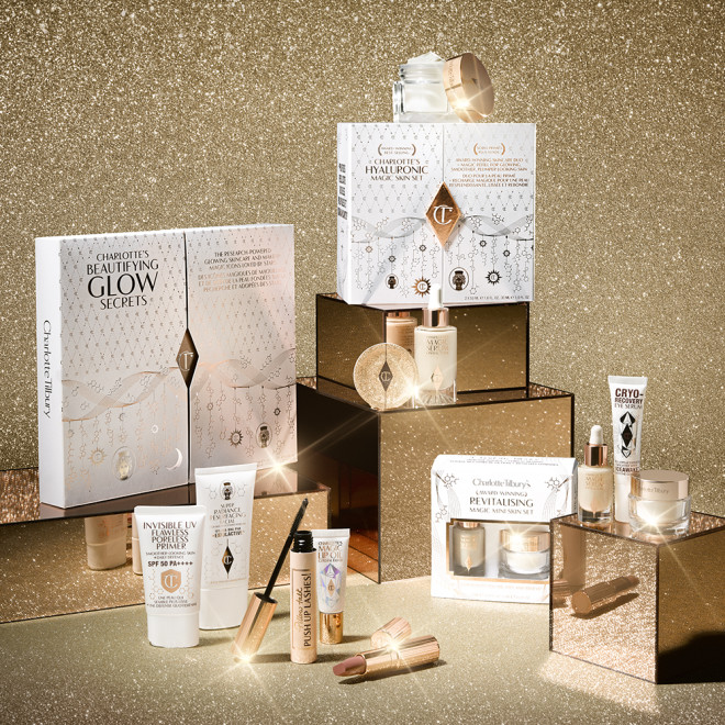A collection of skincare and makeup sets in white and golden-coloured packaging. 