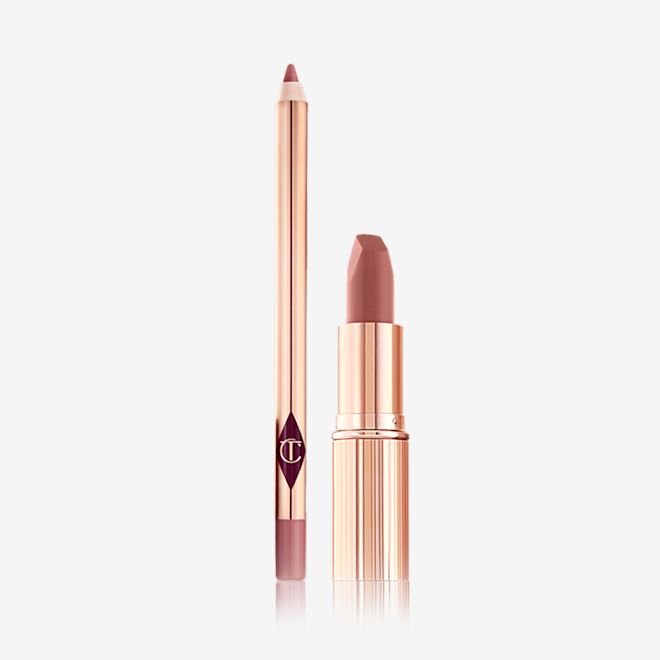 Matte Revolution Lip Slick open An open lip liner pencil in a muted pink colour with an open matte lipstick in a medium-pink shade.