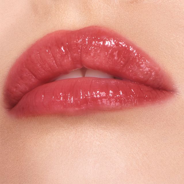Walk of No Shame lip gloss close up How to apply red lipstick step 6: apply a red lip gloss