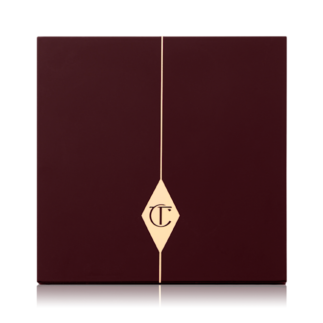 Instant Look in a Palette in Sunset Dreamscape closed A closed face palette with a dark brown-coloured lid with the iconic CT logo printed on the front in gold colour.