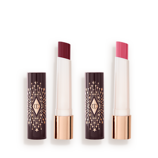 Hyaluronic Happikiss Duo ouvert Deux baumes à lèvres hydratants ouverts dans des teintes rose nude et rose pêche.