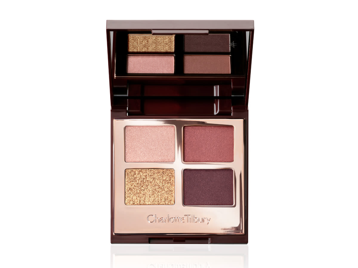 Luxury Palette in The Vintage Vamp open An open, mirrored-lid quad eyeshadow palette with eyeshadows in shades of golden, red, plum, and rose gold.