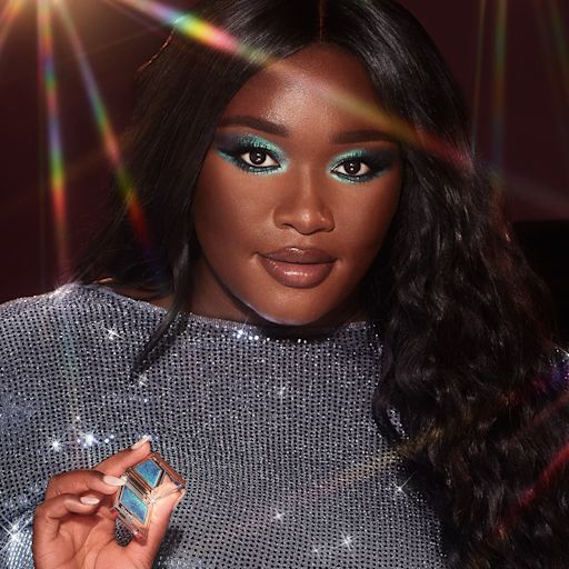 Hypnotising Pop Shot in Cosmic Rocks on deep-tone model with brown eyes Deep-tone brunette model with brown eyes wearing iridescent duochrome purple and teal eyeshadow with very fine shimmer.