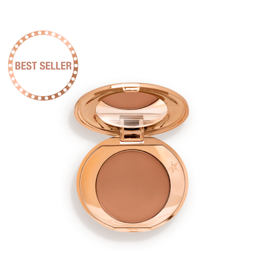 Mini Airbrush Flawless Finish in Deep open An open, mirrored-lid mini, pressed powder compact in a medium-brown shade, perfect for deep-tones.
