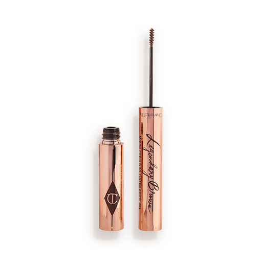 Legendary Brows Eyebrow gel in Soft Brown open Open, tinted brow gel in a soft brown shade with a thin brush for precision, and a shiny, gold-coloured tube.