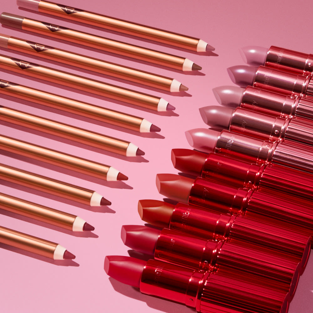 Lipstick and Lip Liner Perfect Pairings Pink and red lip liners and lipsticks lined up with their perfect match
