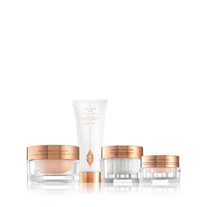 Spa at Home bundle A champagne-coloured night cream, a pearly-white face cream, and a light champagne eye cream, all in glass jars with rose-gold lids with a clay mask in white and rose-gold packaging.