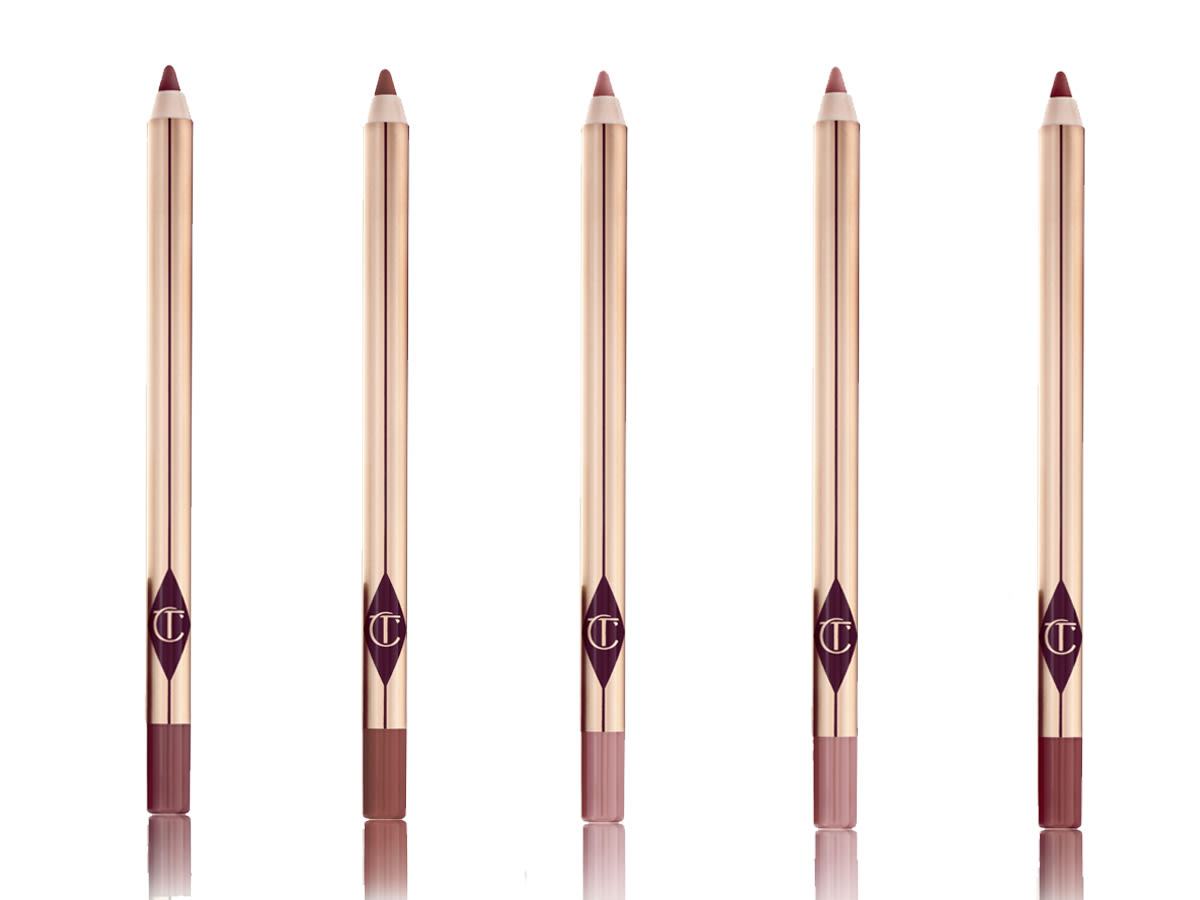 Lip Cheat Lip Liners open A collection of lip liner pencils in shades of pink and brown with golden-coloured packaging.