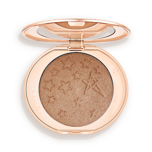 Hollywood Highlighter in Bronze Glow open An open highlighter powder compact with a mirrored lid, in a shimmery bronze-gold shade.