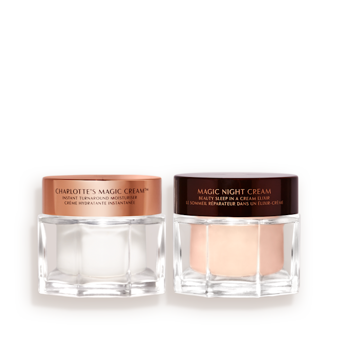 Magic Cream and Magic Night Cream Kit closed Pearly-white face cream in a glass jar with a gold-coloured lid and fawn-coloured night cream in a glass jar with a dark-brown-coloured lid.