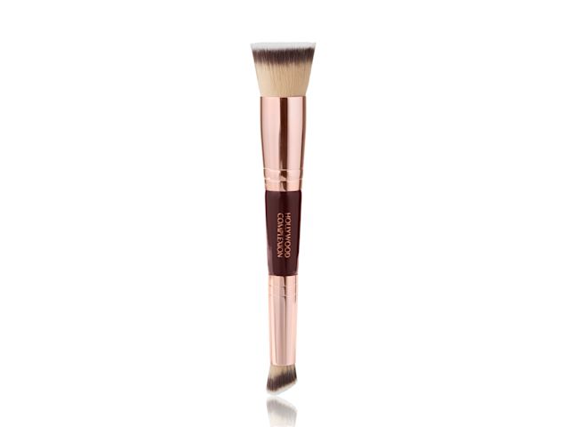 Charlotte's Complexion Brush A double-sided buffing and contouring brush with very fine bristles and the handle in rose gold and dark crimson colour scheme.