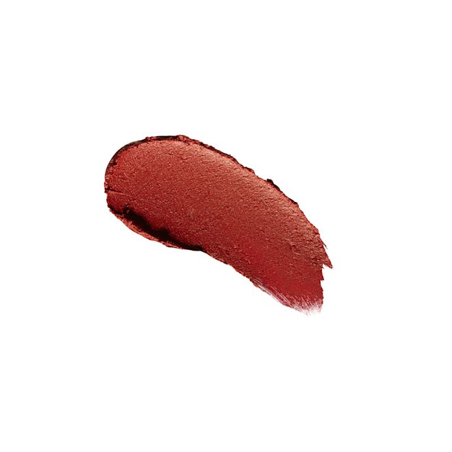 Matte Revolution lipstick in Blossom Red swatch Swatch of a matte, burnt-orange red lipstick.