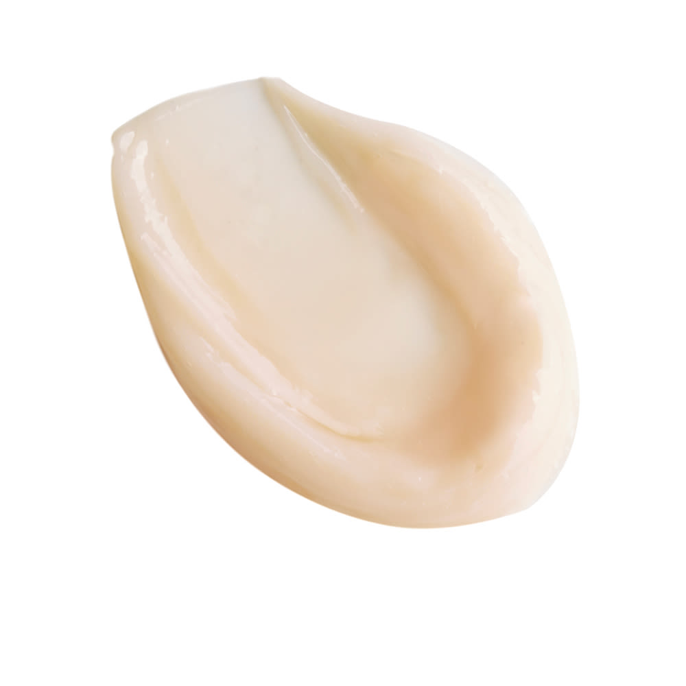 Magic Night Cream swatch Swatch of a thick and luscious, light peach-coloured night cream.