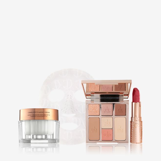 Look of Love Beauty Kit displayed Thick, pearly-white face cream in a glass jar with a gold-coloured lid, textured sheet mask, face palette with three eyeshadows, two blushes, and contour shades, and an open lipstick in a berry-rose shade.