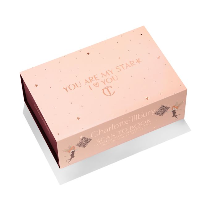 Pink I Love you sleeve A light-pink-coloured makeup sleeve with text in gold on it that reads, 'you are my star. I heart you.'