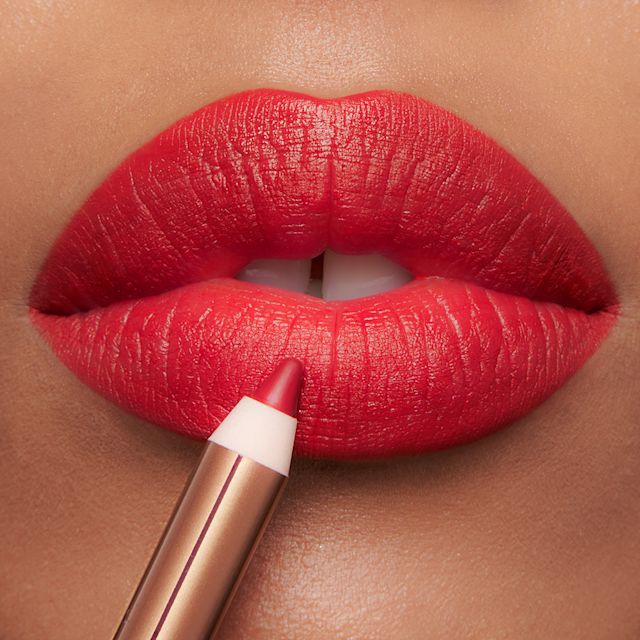 Red Carpet Red lip cheat lip close up How to apply red lipstick step 3: line your lips with a red lip liner