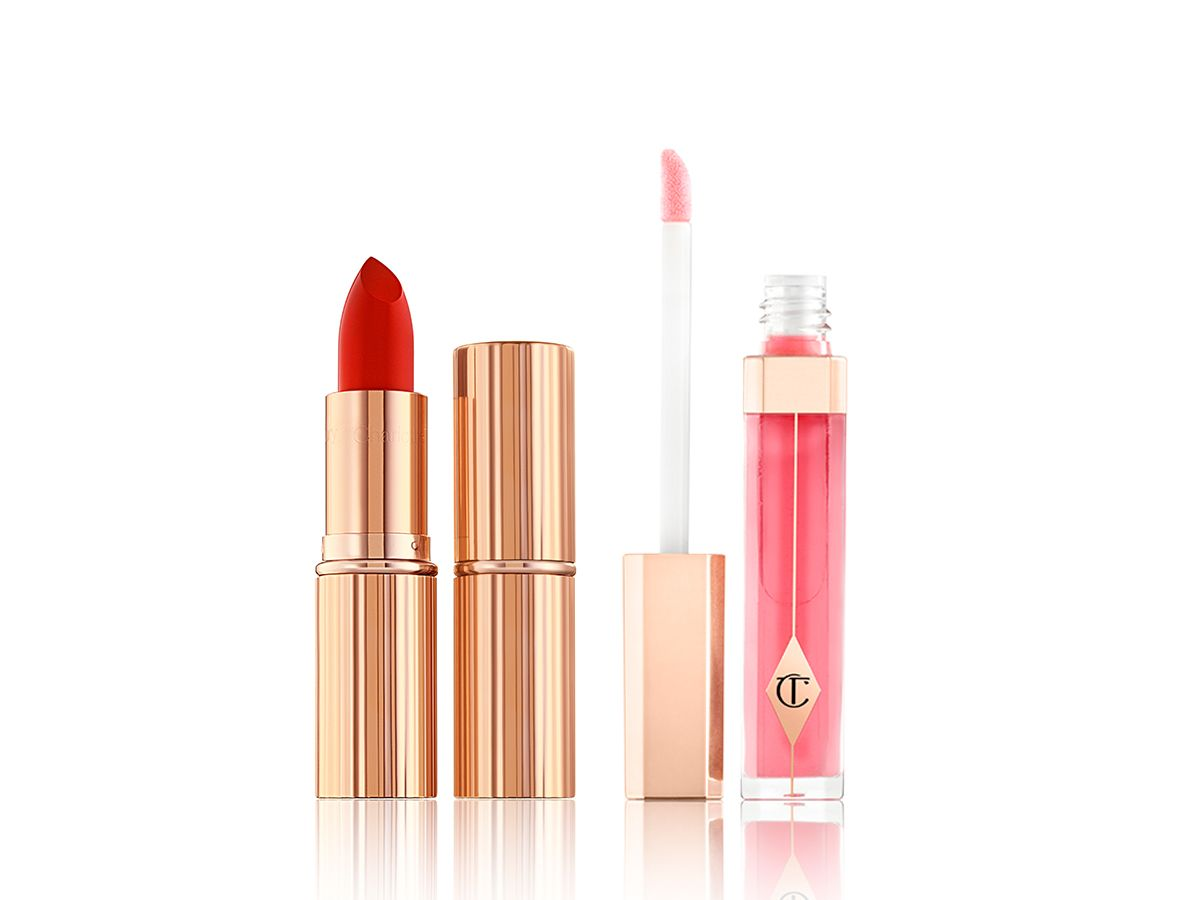 Lip Lustre in Hall of fame and KISSING in Love Bite open Two lipsticks, with and without lid in a vibrant red shade with a cool-tone strawberry-pink lip gloss with its doe-foot applicator next to it.