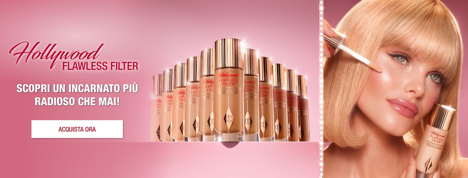 Hollywood Flawless Filter banner Banner with a collection of full-size and travel-size luminous primers in glass bottles with gold-coloured lids in fair, light, medium, and deep shades, and different models wearing the primer, along with text that reads, 'Charlotte's iconic, award-winning Hollywood flawless filter! Shop now!'