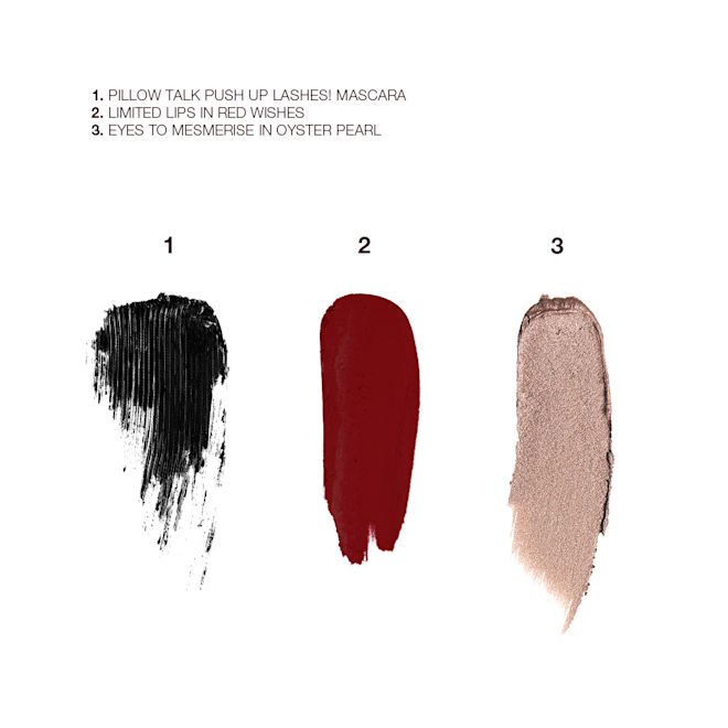 Party Eye and Lip Kit swatches Swatches of black mascara, poppy red lipstick with a matte finish, and cream eyeshadow in an antique oyster-gold shade.