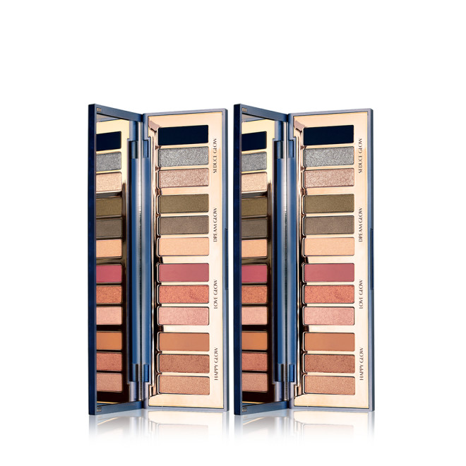Two, open mirrored-lid eyeshadow palettes with matte and shimmery blue, green, pink, and brown shades. 