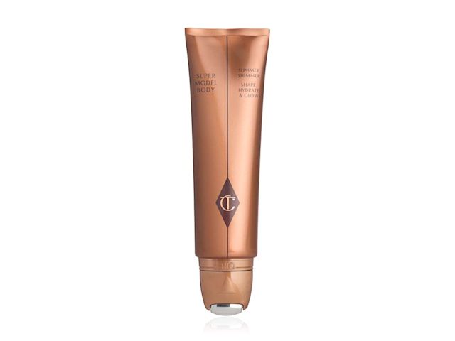 Supermodel Body lid removed A gold-bronze-coloured body highlighter wand with the CT logo printed in the middle in brown and gold.
