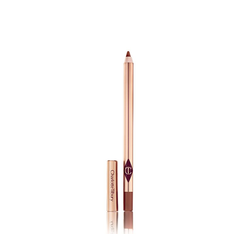 Lip Cheat in Foxy Brown open An open taupe-brown lip liner pencil with its lid next to it and golden-coloured packaging.
