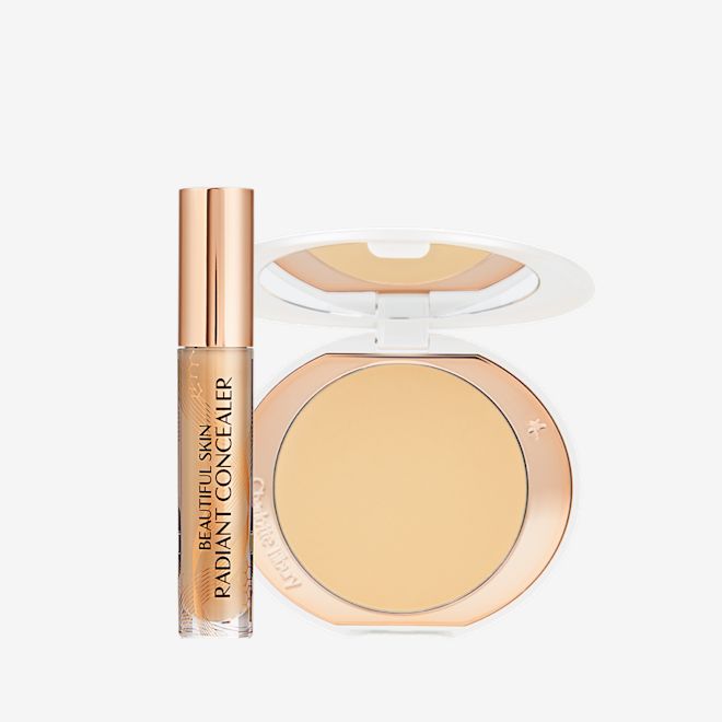 Beautiful Skin, Brighten, Lift Effect Kit displayed Concealer in a glass tube with a gold-coloured lid and a pressed powder in a banana yellow shade in a white-coloured compact.