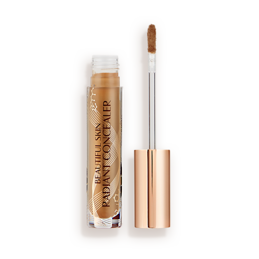 Beautiful Skin concealer in 14 open caramel brown radiant concealer in a glass tube with its gold-coloured lid with a doe-foot end next to it, and text on the tube that reads, 'Beautiful Skin Concealer'