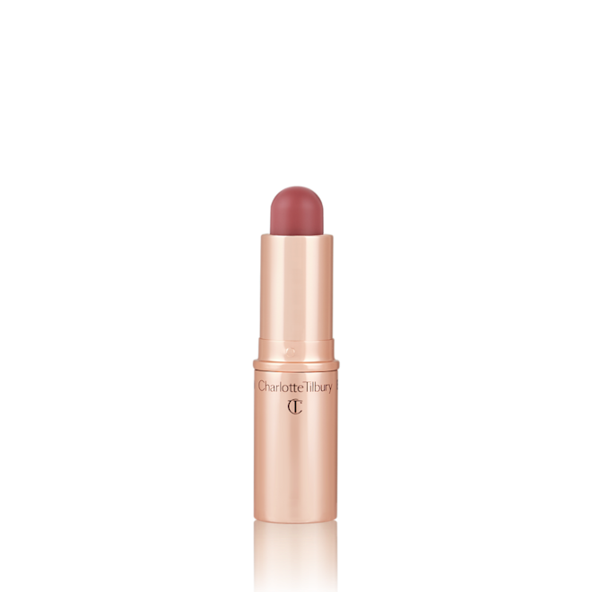 Quick & Easy Instant 5 Minute Pretty Fresh Look lip and cheek stick open An open, lip and cheek colour stick in a glowy coral shade in a golden-coloured tube.