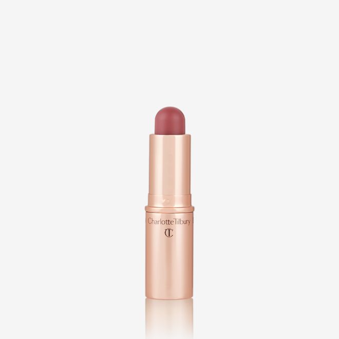 Quick & Easy Instant 5 Minute Pretty Fresh Look lip and cheek stick open An open, lip and cheek colour stick in a glowy coral shade in a golden-coloured tube.