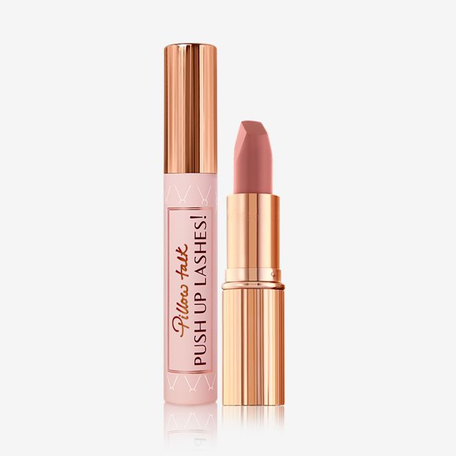 Pillow Talk Lipstick and Mascara Kit A black-coloured mascara with a nude pink tube and a gold-coloured lid and an open, nude pink lipstick in a gold-coloured tube.