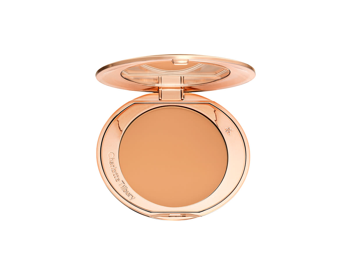 Airbrush Flawless Finish 3 Tan open An open-pressed powder compact in a sandy brown shade.