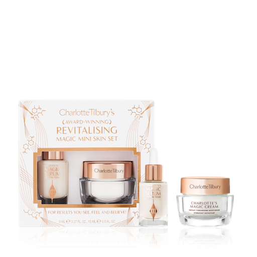 Revitalising Mini Skincare Kit with box displayed Travel-size ivory-coloured luminous serum in a glass bottle and travel-size pearly-white face cream in a glass jar with a gold-coloured lid.