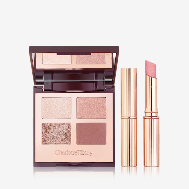 Bigger Brighter Eyes & Pillow Talk in Diamonds Lip Kit open An open, mirrored-lid quad eyeshadow palette in shimmery and matte nude shades with an open, glitter lipstick in nude pink and a closed lipstick, both in golden-coloured tubes.