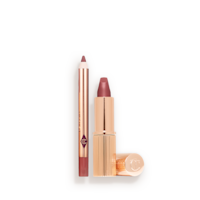 Travel Size Pillow Talk Medium Kit open An open mini lipstick in a brown-pink colour with its lid next to it and a mini lip liner pencil in a matching shade.