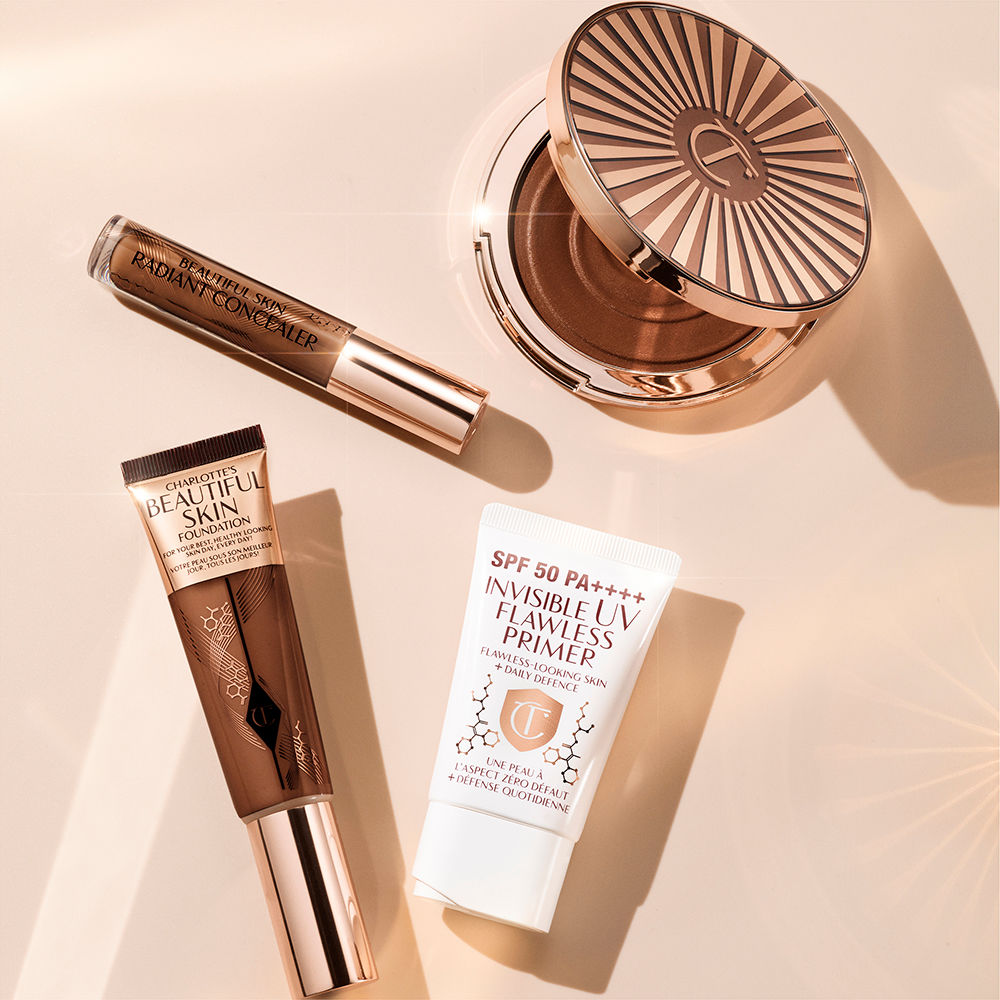 Beautiful Skin still life Radiant makeup products including Beautiful Skin foundation, concealer, bronzer and SPF primer