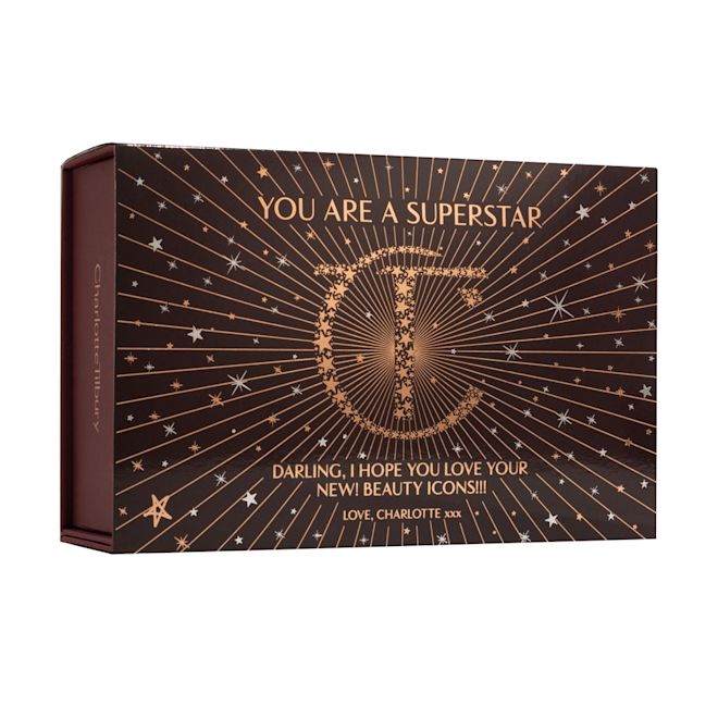 You are a Superstar Sleeve for Gifting Black-coloured makeup sleeve with golden stars and a starburst pattern on the front and the CT logo printed in gold colour in the middle along with the text, ''you are a superstar' written on top.