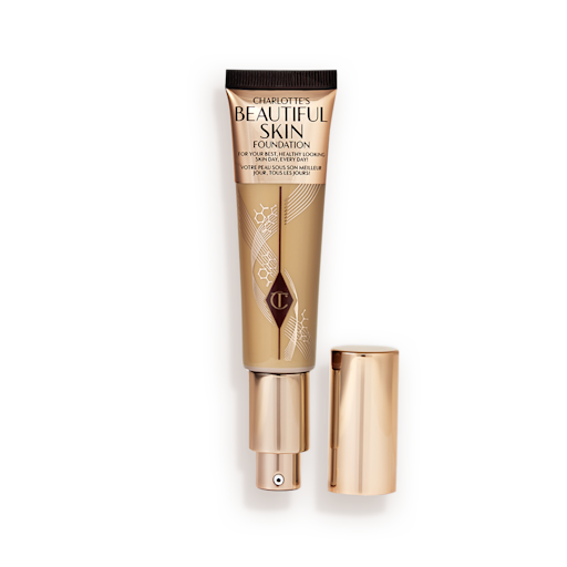 Beautiful Skin Foundation in Shade 8W open An open foundation wand in gold packaging with a pump dispenser and a medium-dark-brown-coloured body to show the shade of the foundation inside.