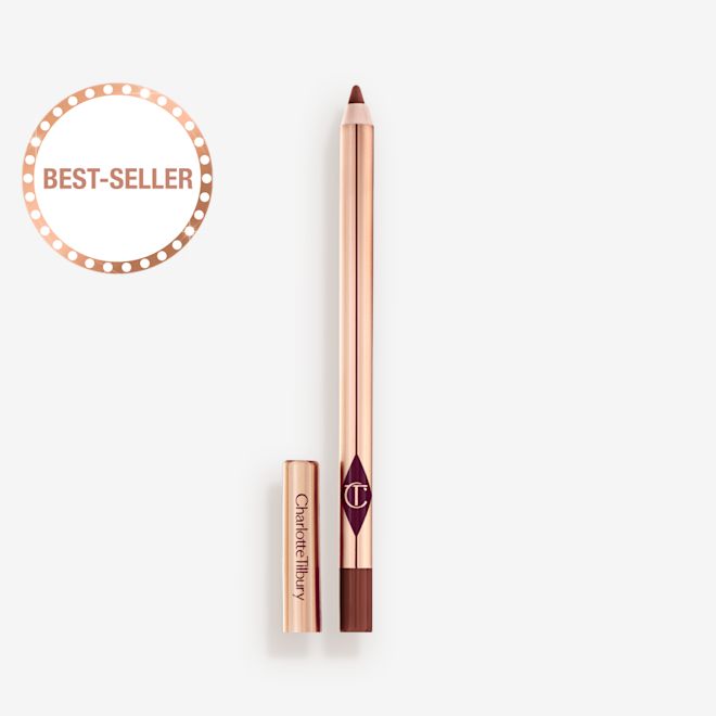 Crayon à lèvres Lip Cheat Pillow Talk Intense sans bouchon Crayon à lèvres brun fauve de taille standard sans bouchon et avec un extérieur réfléchissant de couleur dorée.