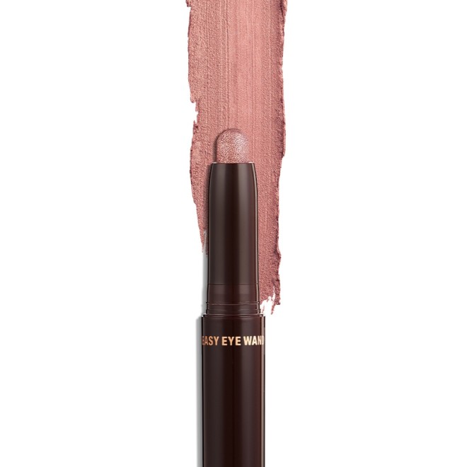 An open, cream eyeshadow wand in a sultry- sunset-pink shimmer shade.