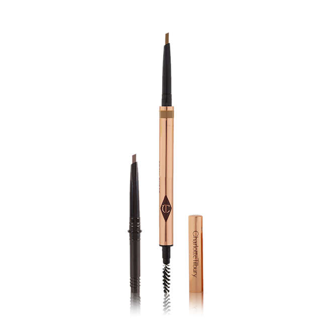 Brow Cheat in Light Blonde Full Size and Refill Kit open A double-ended eyebrow pencil and spoolie brush duo in a light blonde shade with gold-coloured packaging and the refill besides it.
