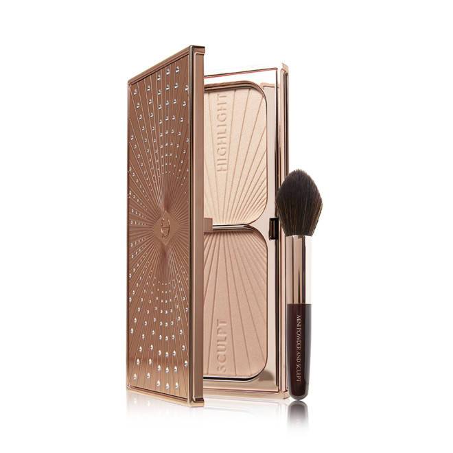 An open duo contour palette with a light beige shade and medium-brown shade with a contouring and bronzer brush. 
